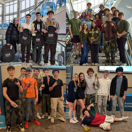 Groups of smiling teenagers holding trophies and awards at an indoor event.