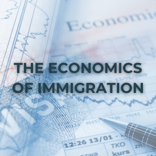 A pen on a graph paper with text "The Economics of Immigration" and blurred financial documents in the background.